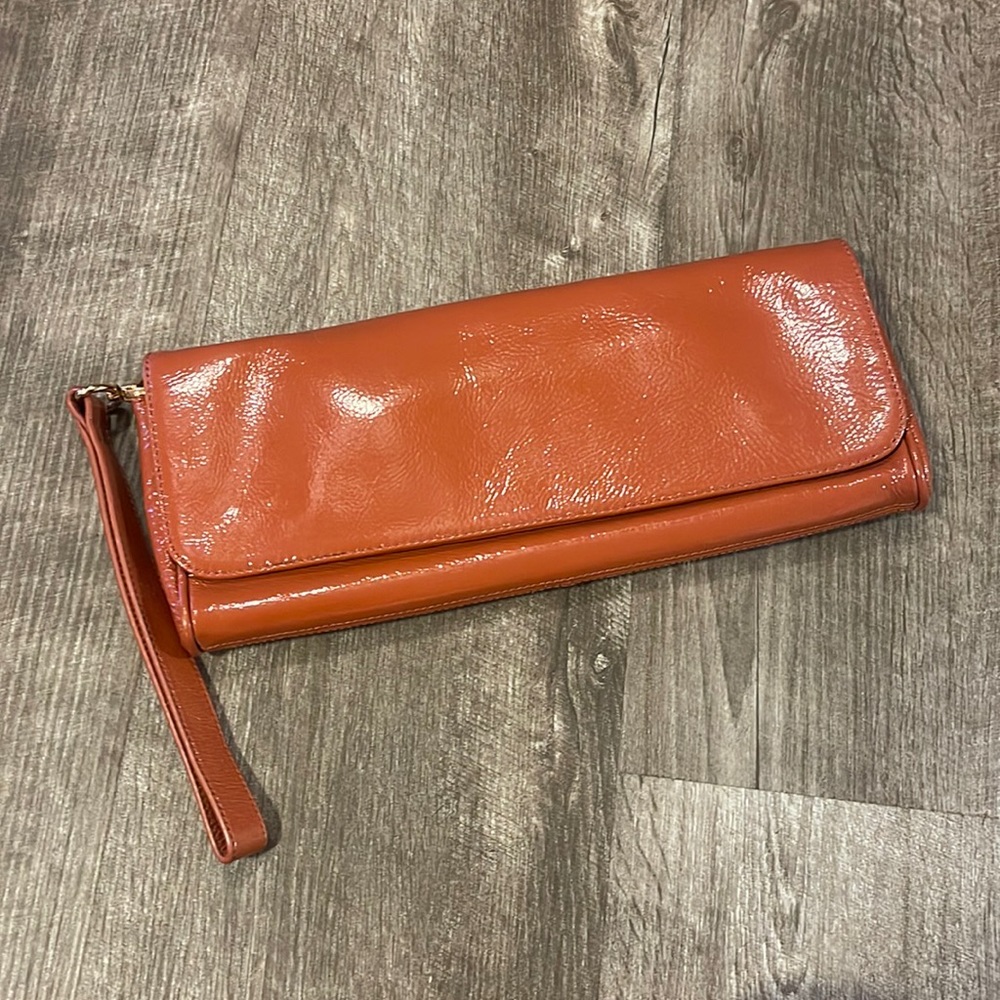 Hobo International burnt orange clutch wristlet